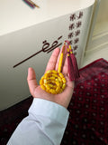 مسباح صنوبري طربوش عنابي