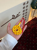 تراب كهرمان ملطخ طربوش احمر